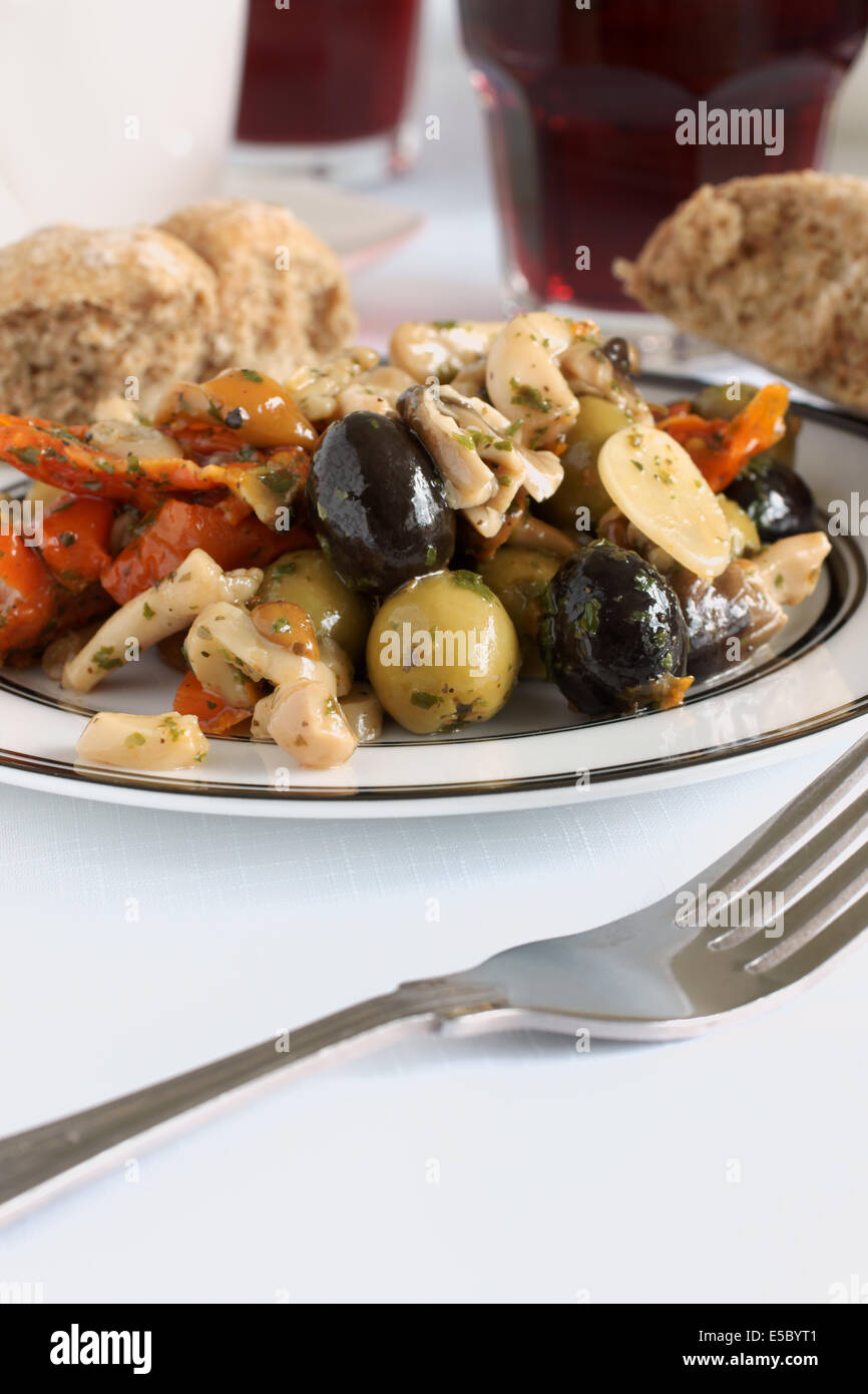 Antipasti made with olives sundried tomato and shitake mushrooms Stock Photo