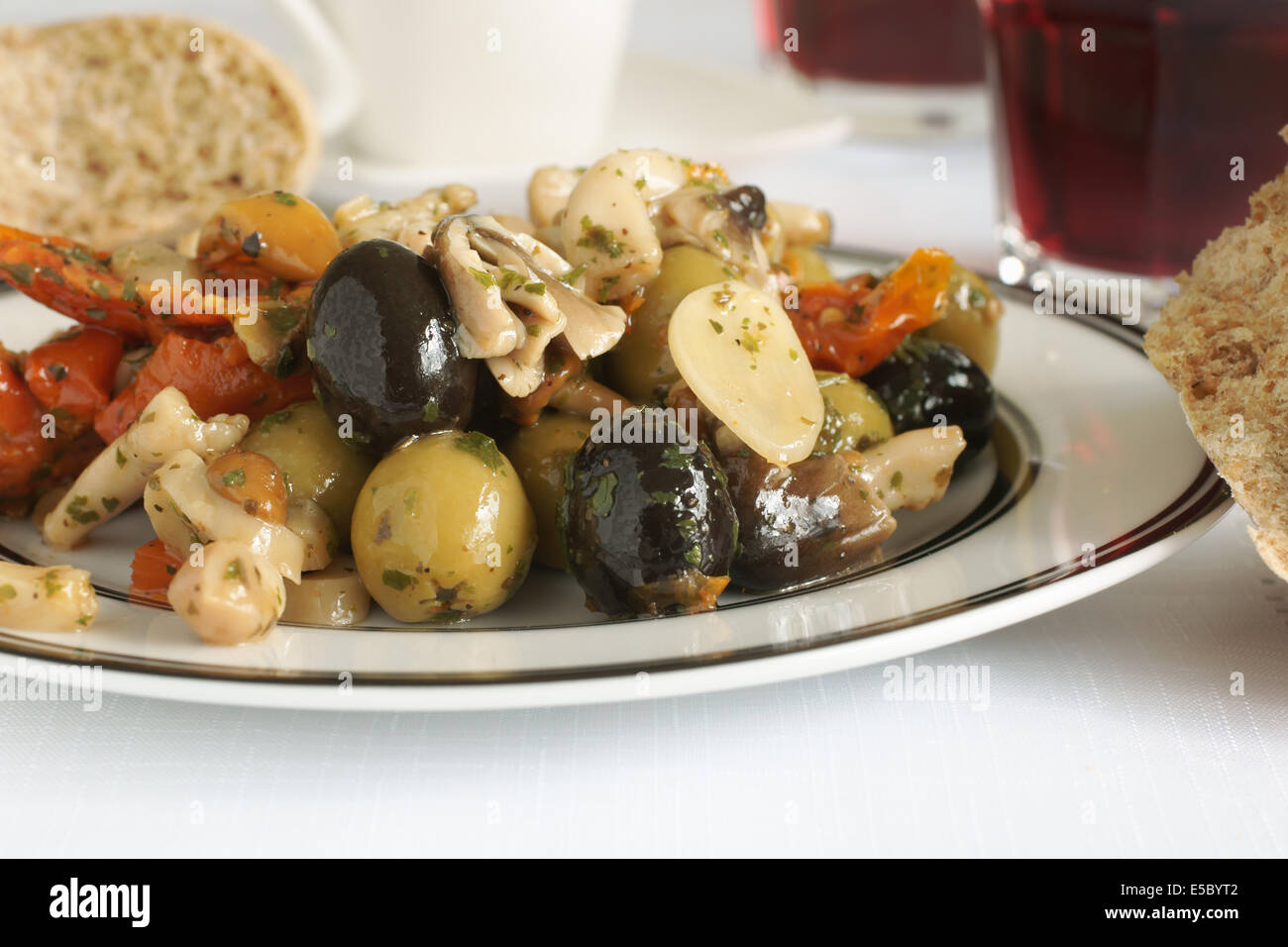 Antipasti made with olives garlic sundried tomato and shitake mushrooms Stock Photo