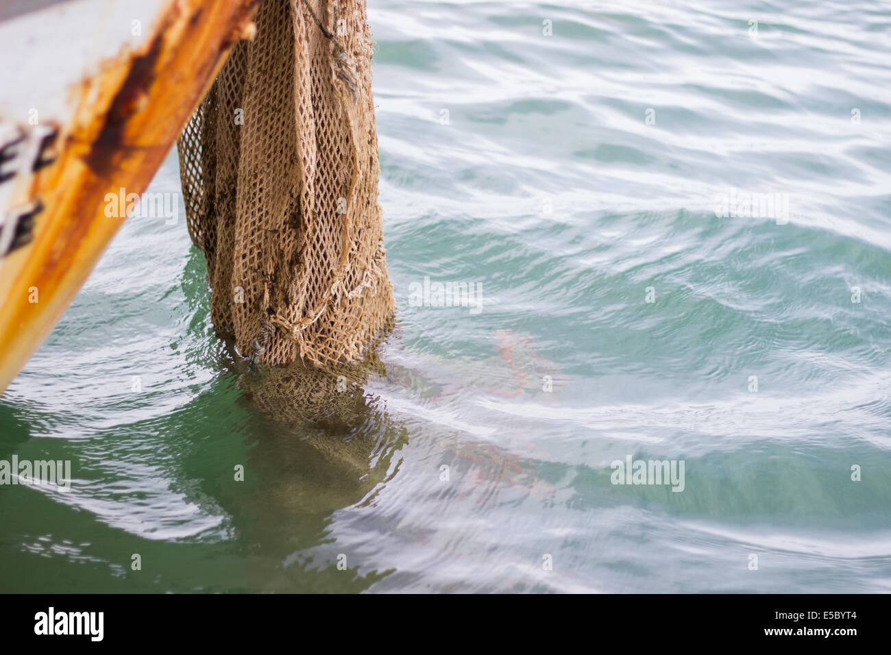 Fishnet boat sea industry hi-res stock photography and images - Alamy