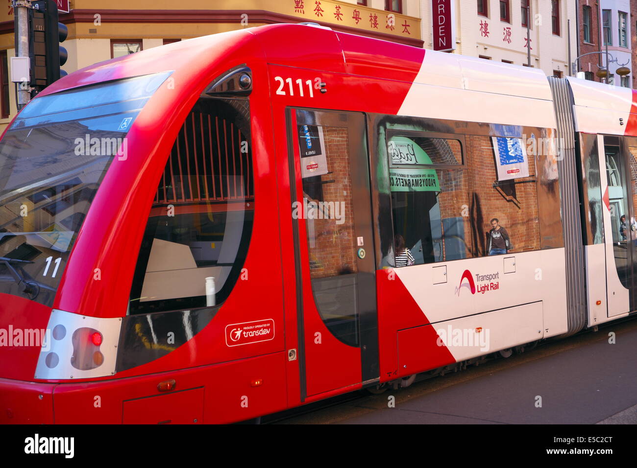 sydney light rail vehicle running through haymarket chinatown,sydney,australia Stock Photo