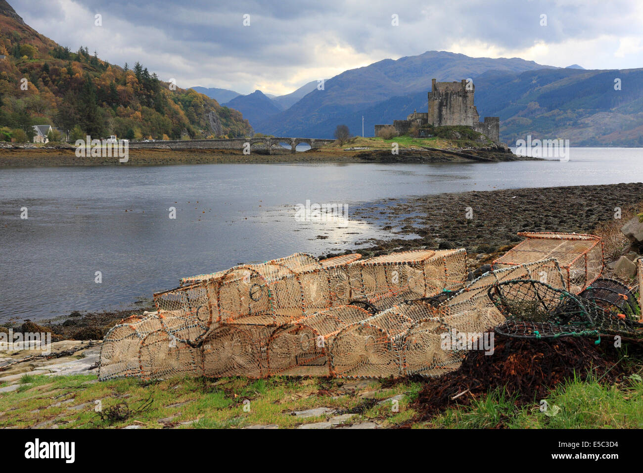 Eilean Donan Castle and lobster pots beside Loch Duich, Scotland Stock Photo
