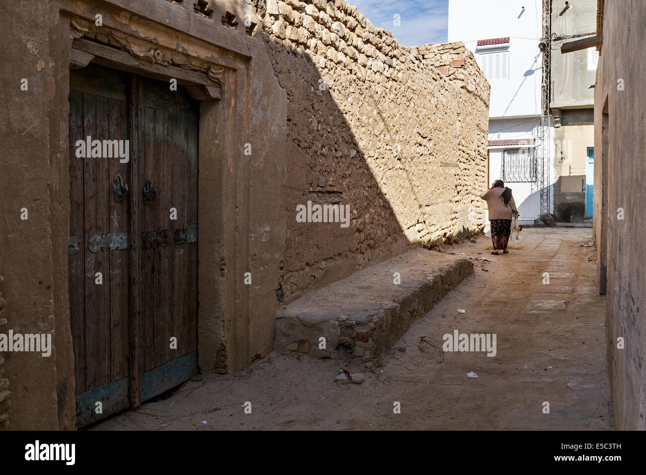 Tunisia. Nefta Medina. Woman in lane. Stock Photo