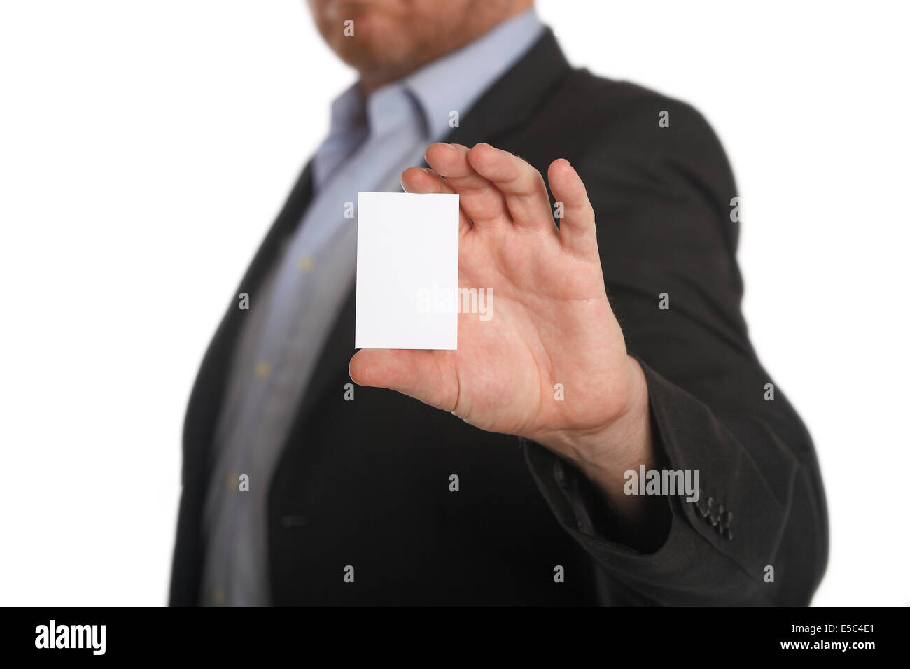 Businessman with business card in front of a white background Stock Photo