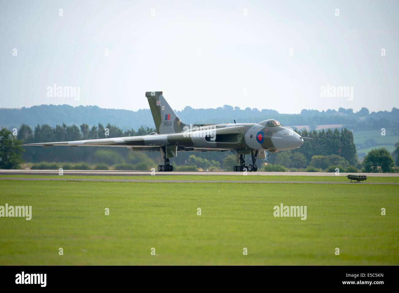 Yeovilton, UK. 26th July, 2014. Air display at RNAS Yeovilton.  Vulcan XH558 piloted by Martin Withers DFC. Credit:  David Hammant/Alamy Live News Stock Photo