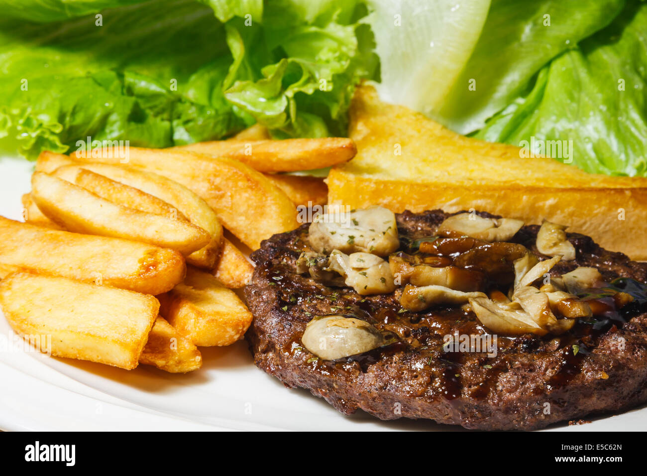 Teriyaki beef with french fries and green vegetable Stock Photo