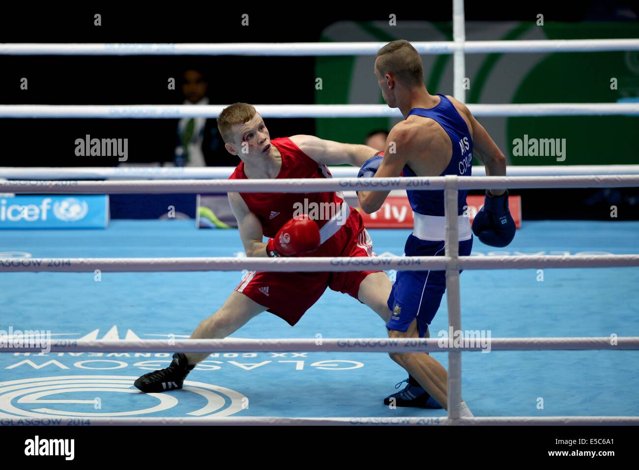 Glasgow, UK. 27th July, 2014. Commonwealth Games day 4. Boxing - Men’s light and light-welter weight bouts.  Charlie Flynn (Scotland, red) beats Nick Cooney (Australia, blue) in their men's lightweight (60kg) preliminary round bout Credit:  Neville Styles/Alamy Live News Stock Photo