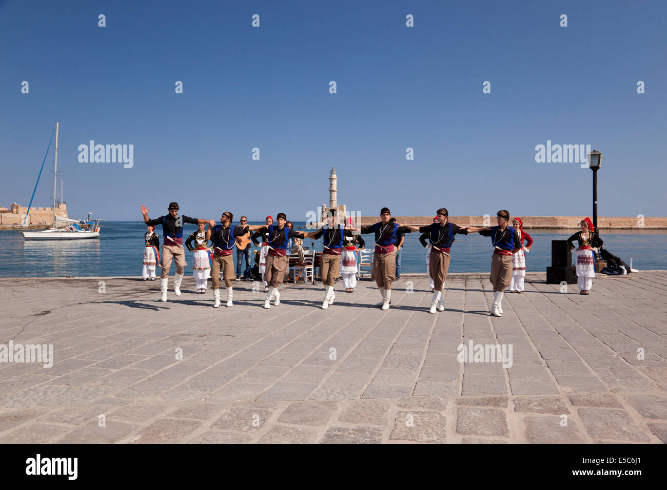 Traditional Greek Cretan Dancers, Chania harbour, Crete, Greece Stock Photo