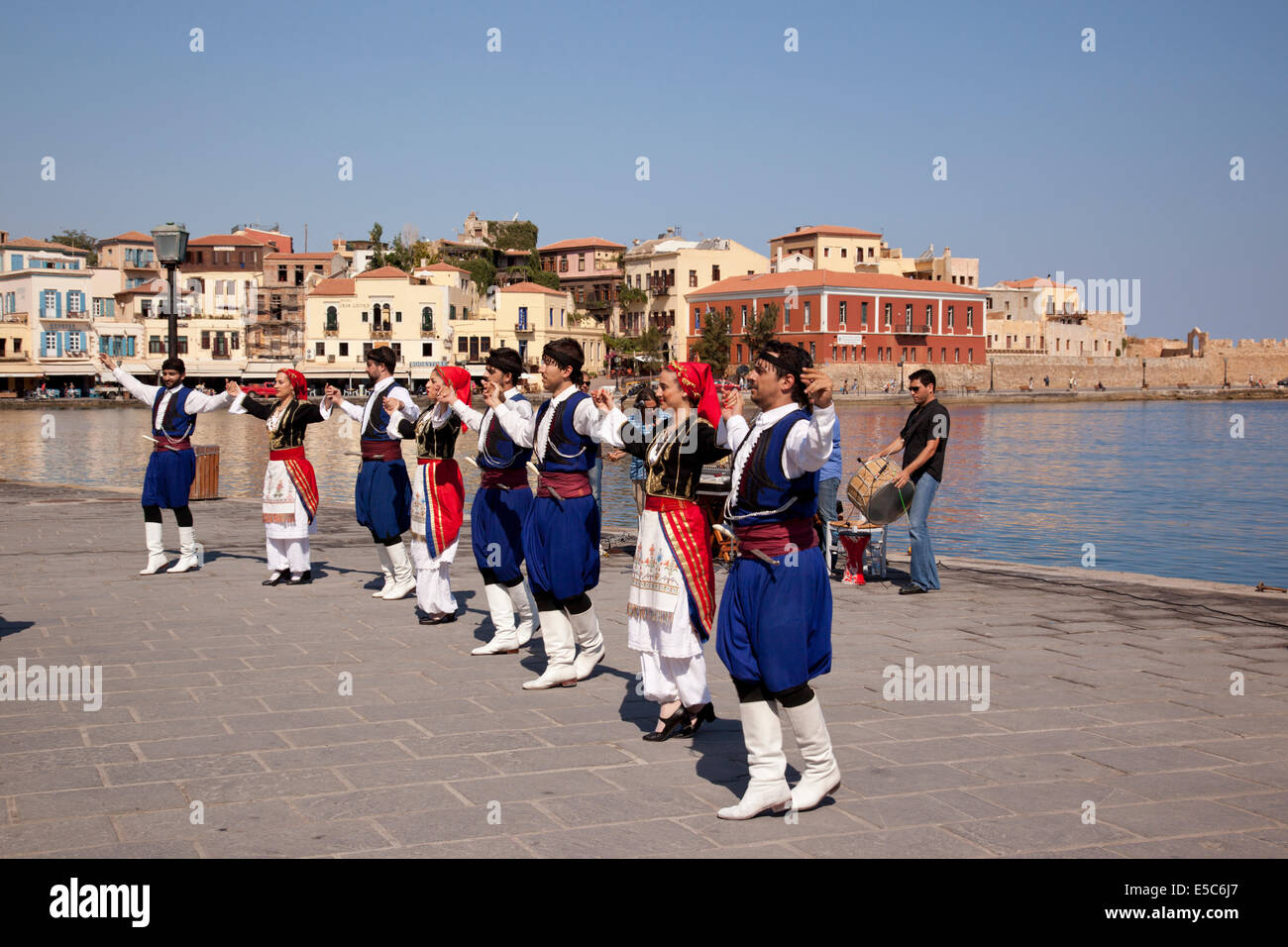 Traditional Greek Cretan Dancers, Chania harbour, Crete, Greece Stock Photo