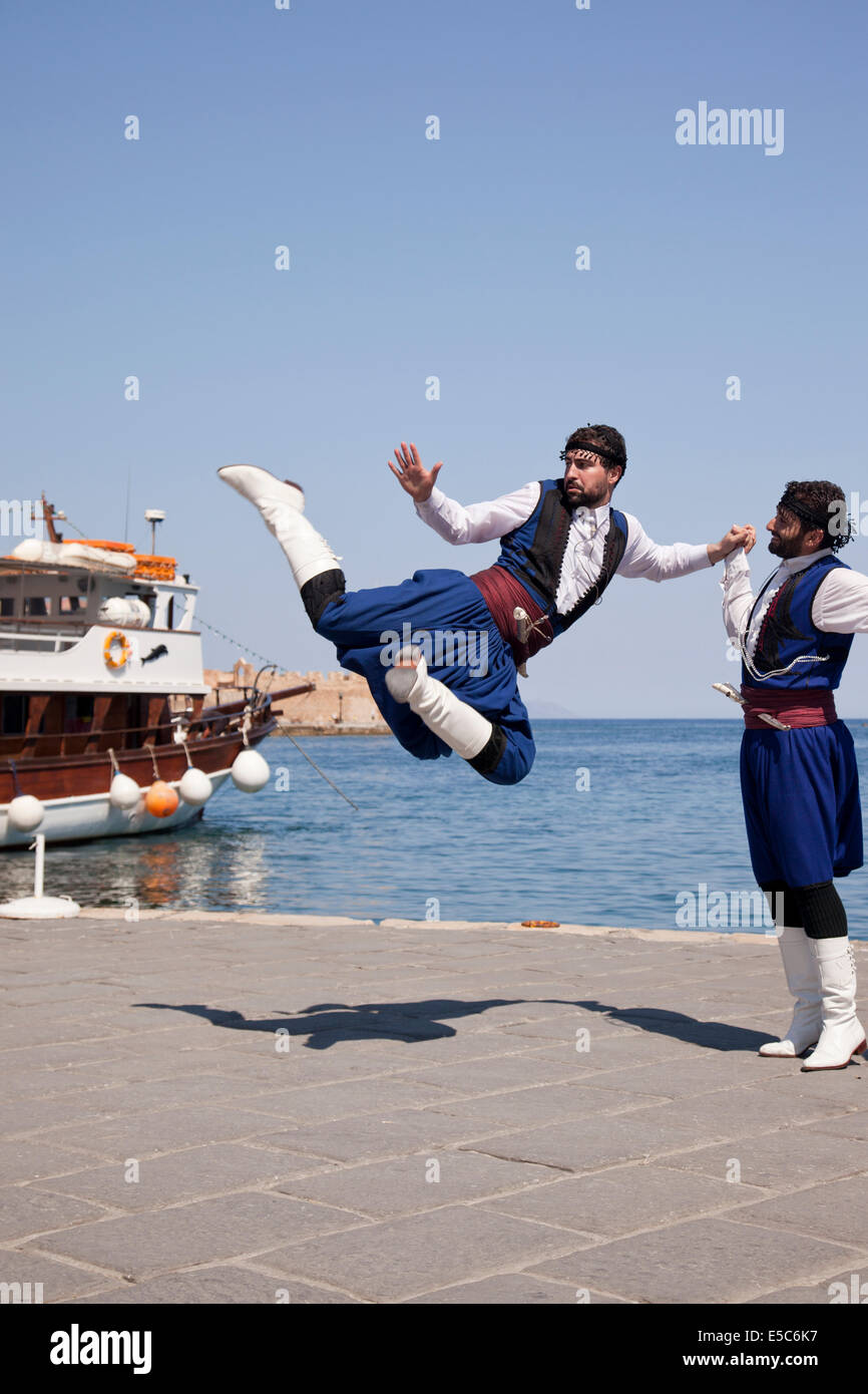 Traditional Greek Cretan Dancers, Chania harbour, Crete, Greece Stock Photo