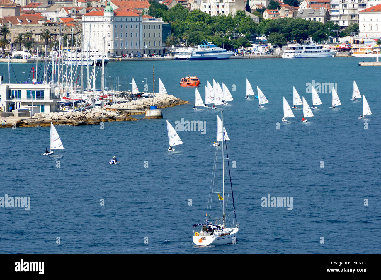 Small sailing dinghies with Split port, marina, & waterfront beyond Croatia Dalmatia Adriatic Sea Stock Photo