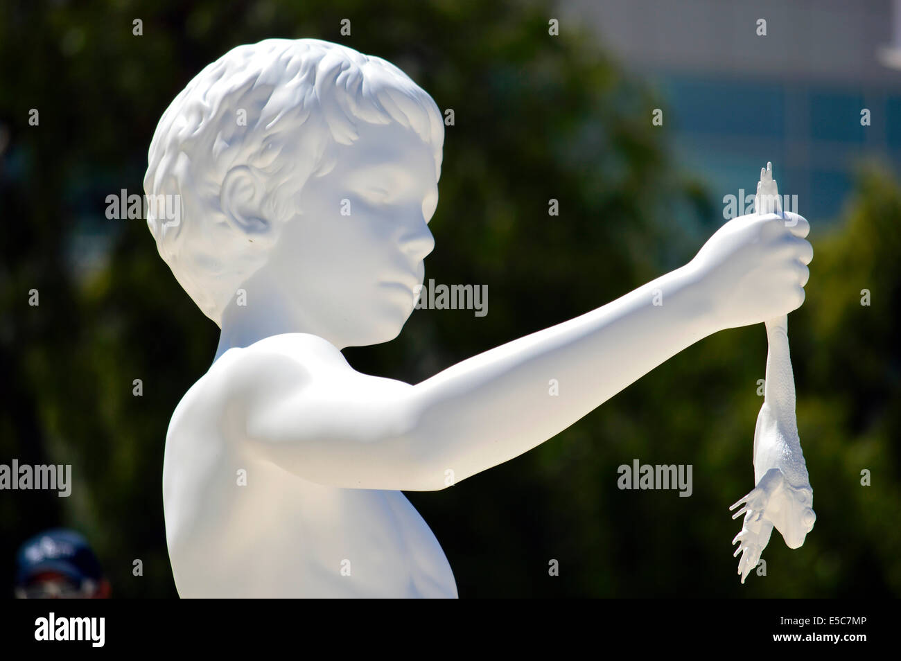 A statue of a boy holding a frog outside the Getty Institute and Museum in Los Angeles. Stock Photo