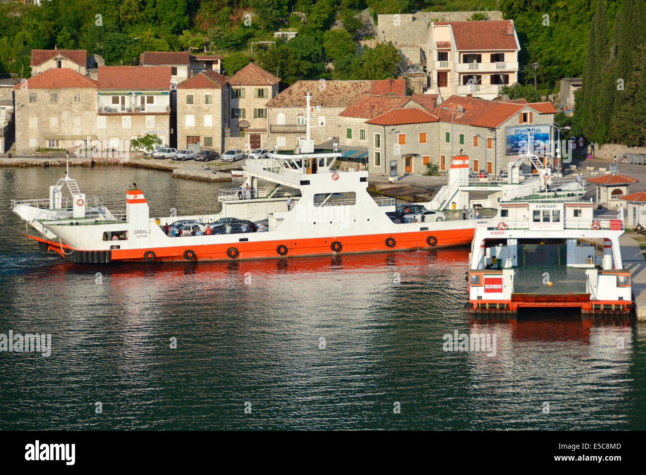 Ferries at Lepetane harbour that make the short crossing to Kamenari across the Verige Strait in Kotor Bay Stock Photo