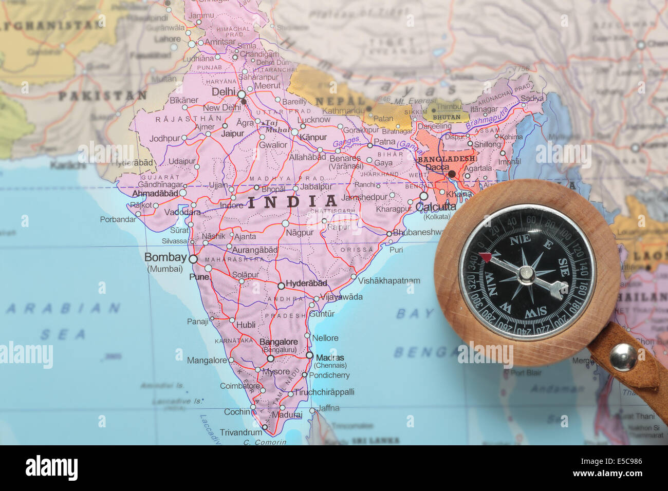 Compass on a map pointing at India and planning a travel destination Stock Photo