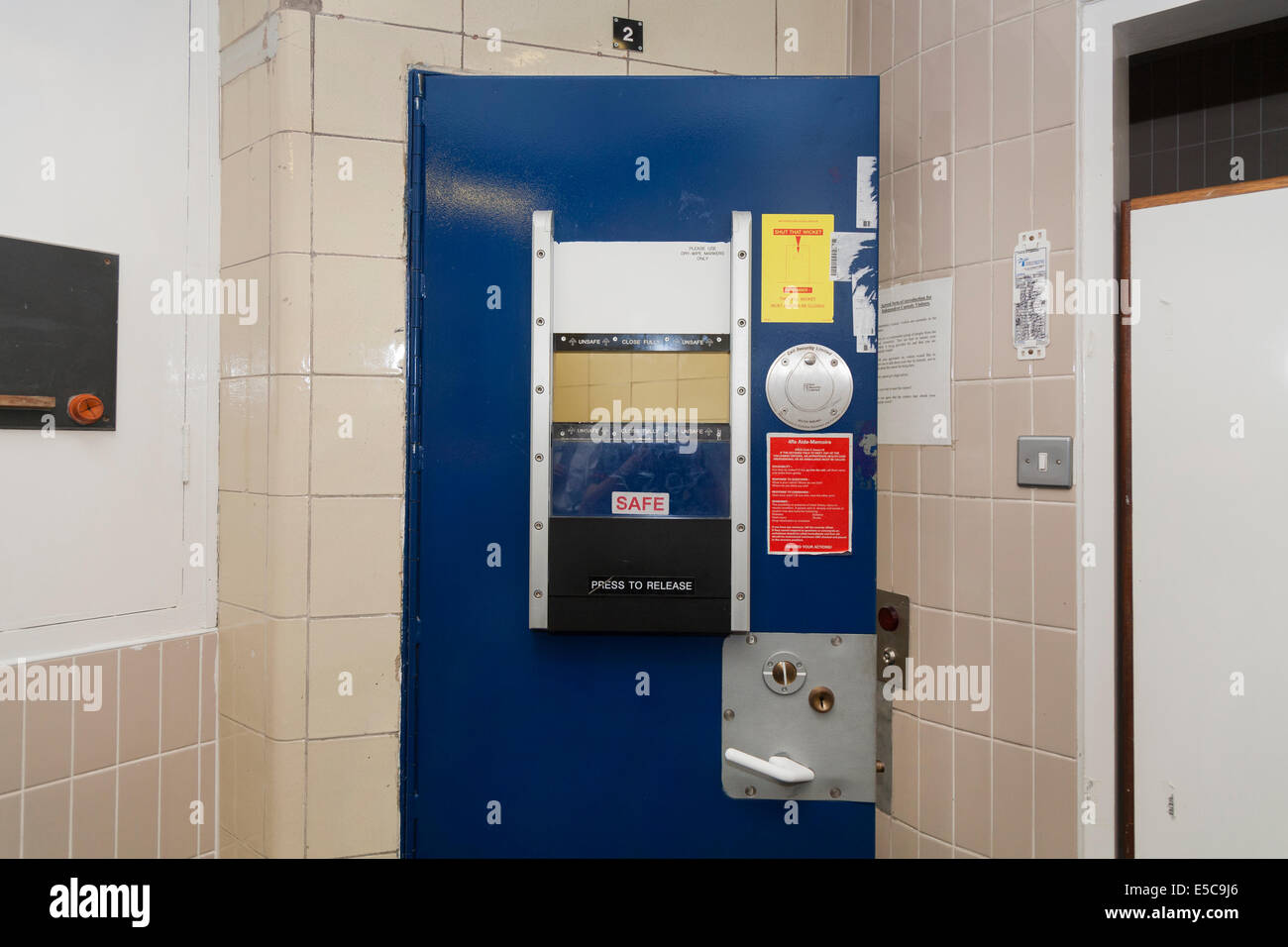 Metropolitan Police prisoner 's cell door in a Police station custody suite / suites / cell / cells in Twickenham. London UK Stock Photo