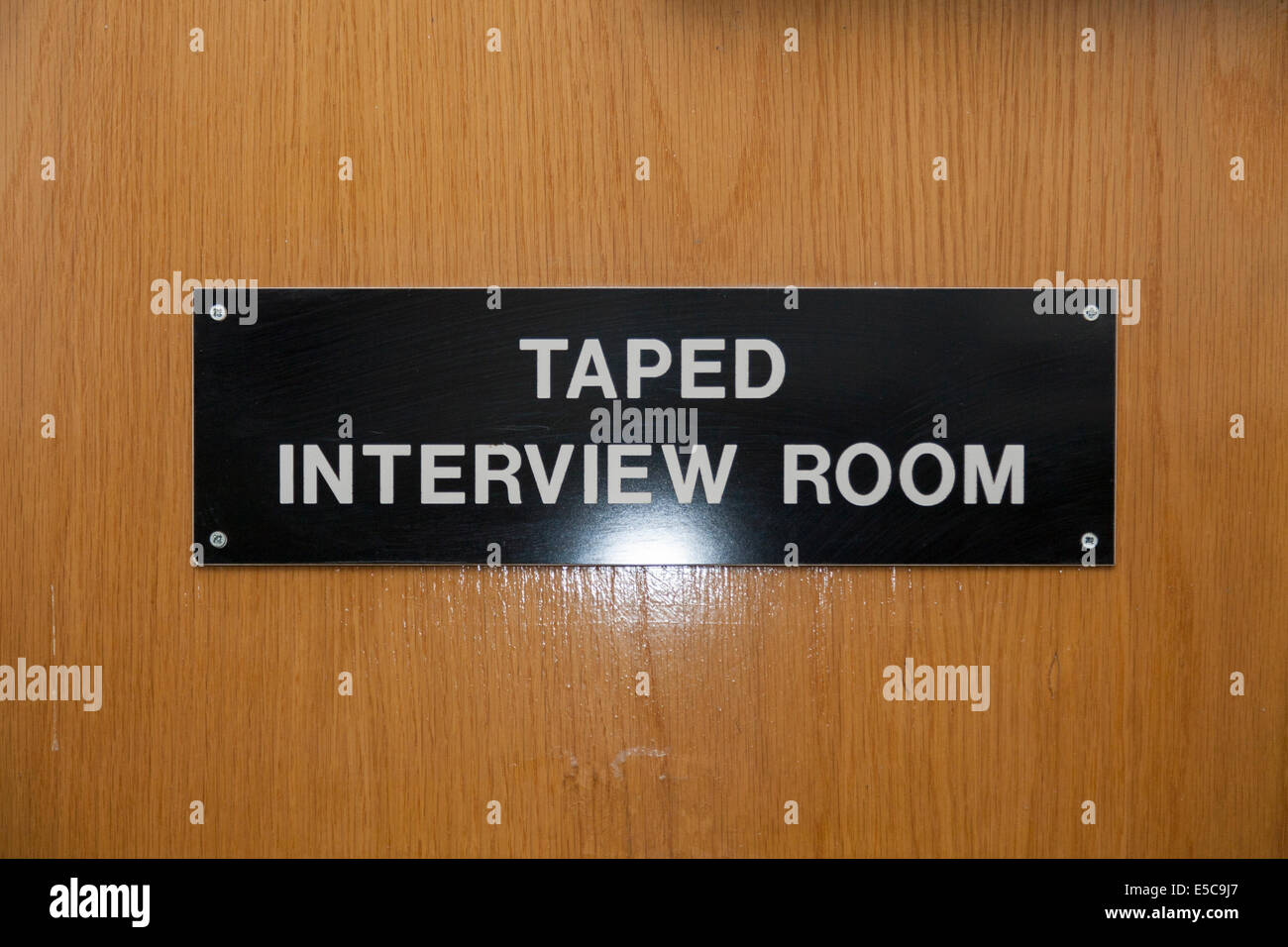 Metropolitan Police Taped Interview Room sign in a Police station custody suite / suites / cell / cells in Twickenham. London UK Stock Photo