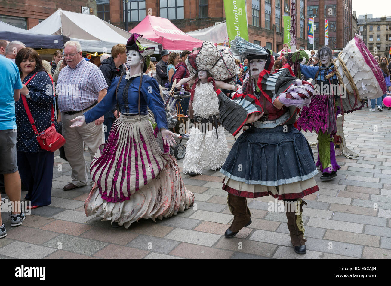 Street entertainers performing at the Merchant City festival during the