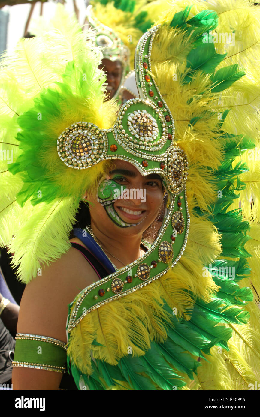 London, UK. 27 July 2014. A lady in a carnival headgear seen taking part in the parade. Credit: David Mbiyu/ Alamy Live News Stock Photo