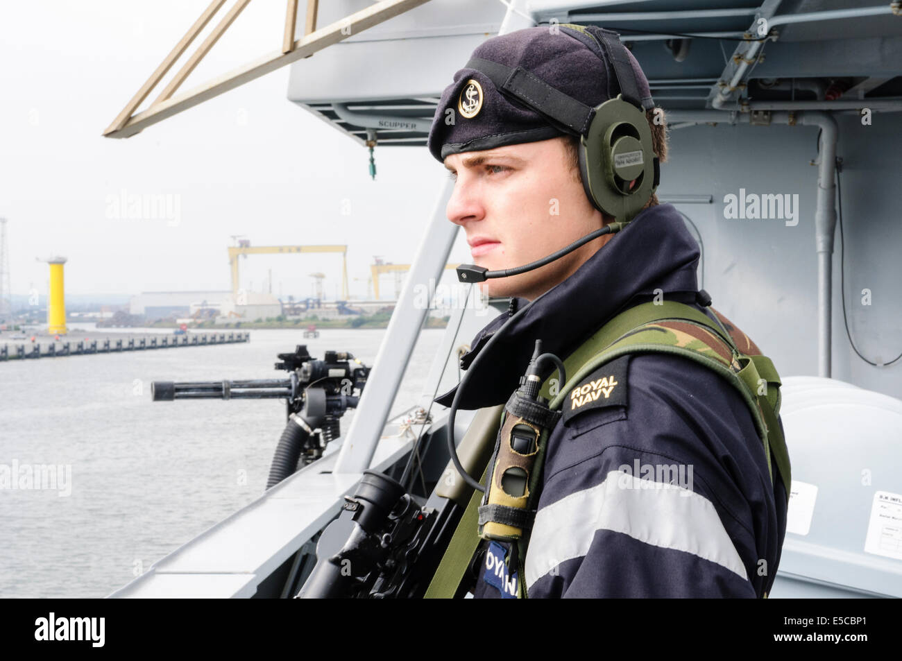 Belfast, Northern Ireland. 26/07/2014 - Sailor armed with a SA-80 assault rifle stands guard on the Type 45 destroyer HMS Duncan, as she arrives into her adopted city of Belfast for a three day visit. Credit:  Stephen Barnes/Alamy Live News Stock Photo