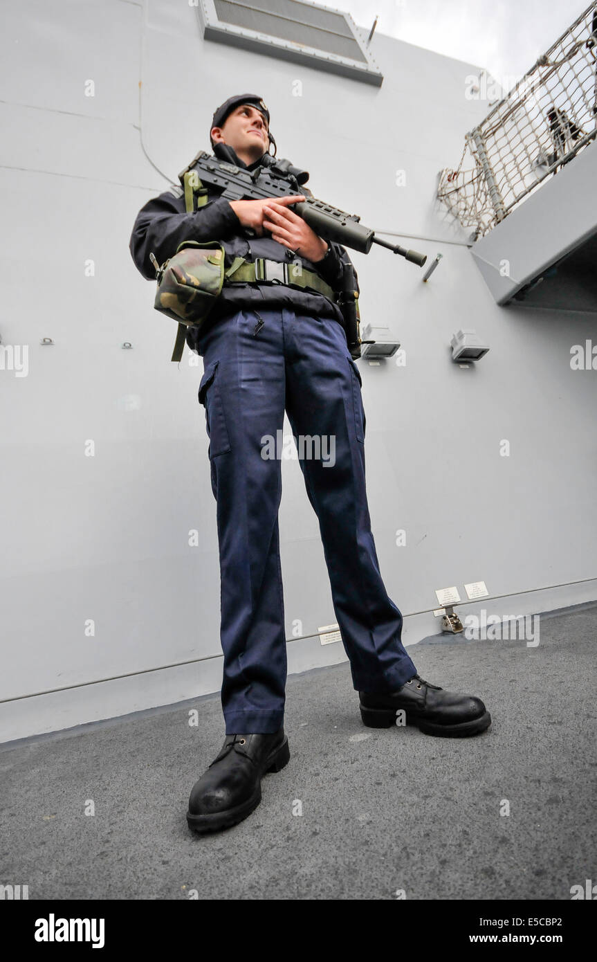 Belfast, Northern Ireland. 26/07/2014 - Sailor armed with a SA-80 assault rifle stands guard on the Type 45 destroyer HMS Duncan, as shearrives into her adopted city of Belfast for a three day visit. Credit:  Stephen Barnes/Alamy Live News Stock Photo