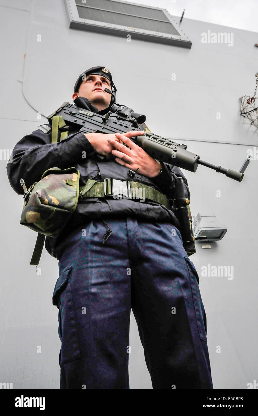 Belfast, Northern Ireland. 26/07/2014 - Sailor armed with a SA-80 assault rifle stands guard on the Type 45 destroyer HMS Duncan, as shearrives into her adopted city of Belfast for a three day visit. Credit:  Stephen Barnes/Alamy Live News Stock Photo