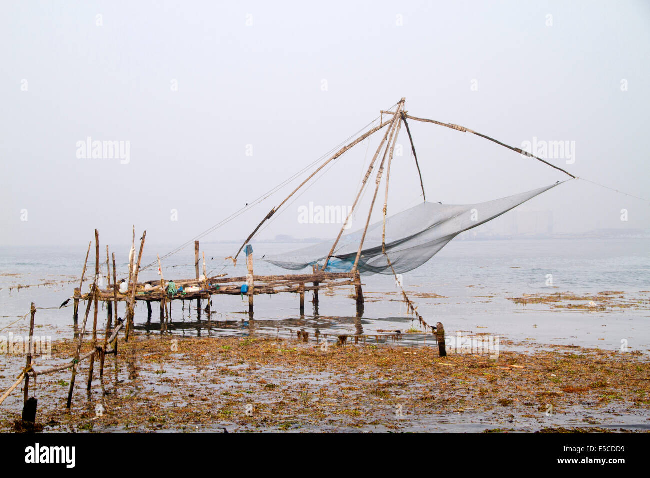 Chinese fishing net used to dip fish from the ocean on the