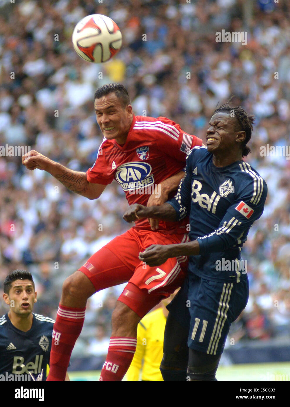 Vancouver, Canada. 27th July, 2014. FC Dallas' Blas Perez (L) vies with Vancouver Whitecaps' Darren Mattocks during their MLS soccer game at BC Place in Vancouver, Canada, on July 27, 2014. Vancouver Whitecaps tied FC Dallas 2-2. Credit:  Sergei Bachlakov/Xinhua/Alamy Live News Stock Photo