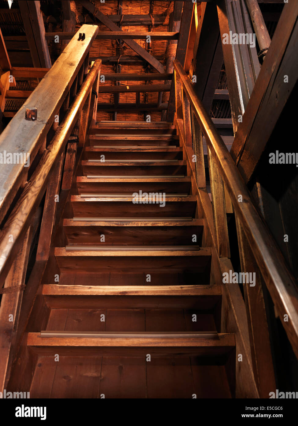 Old wooden staircase leading upstairs in a historic Japanese house Stock Photo