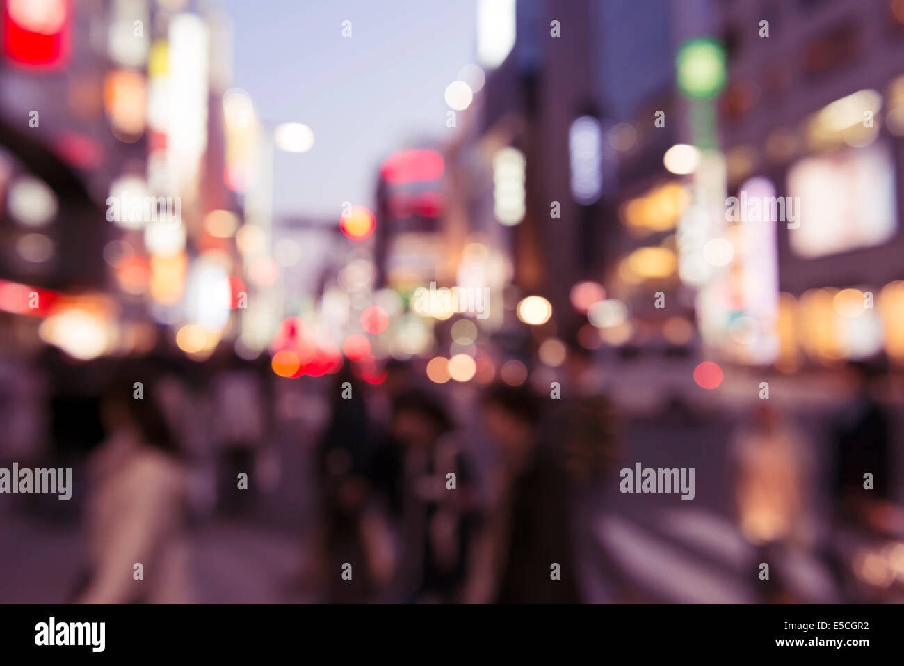 Abstract out-of-focus city scenery with colorful lights at dusk. Tokyo, Japan. Stock Photo