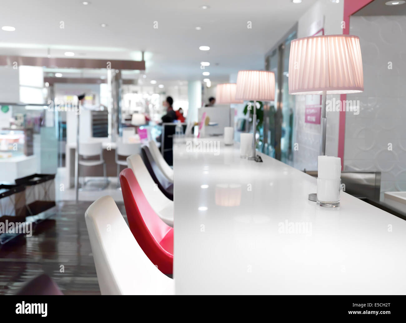 Cafe counter with chairs, contemporary brightly lit interior. Tokyo