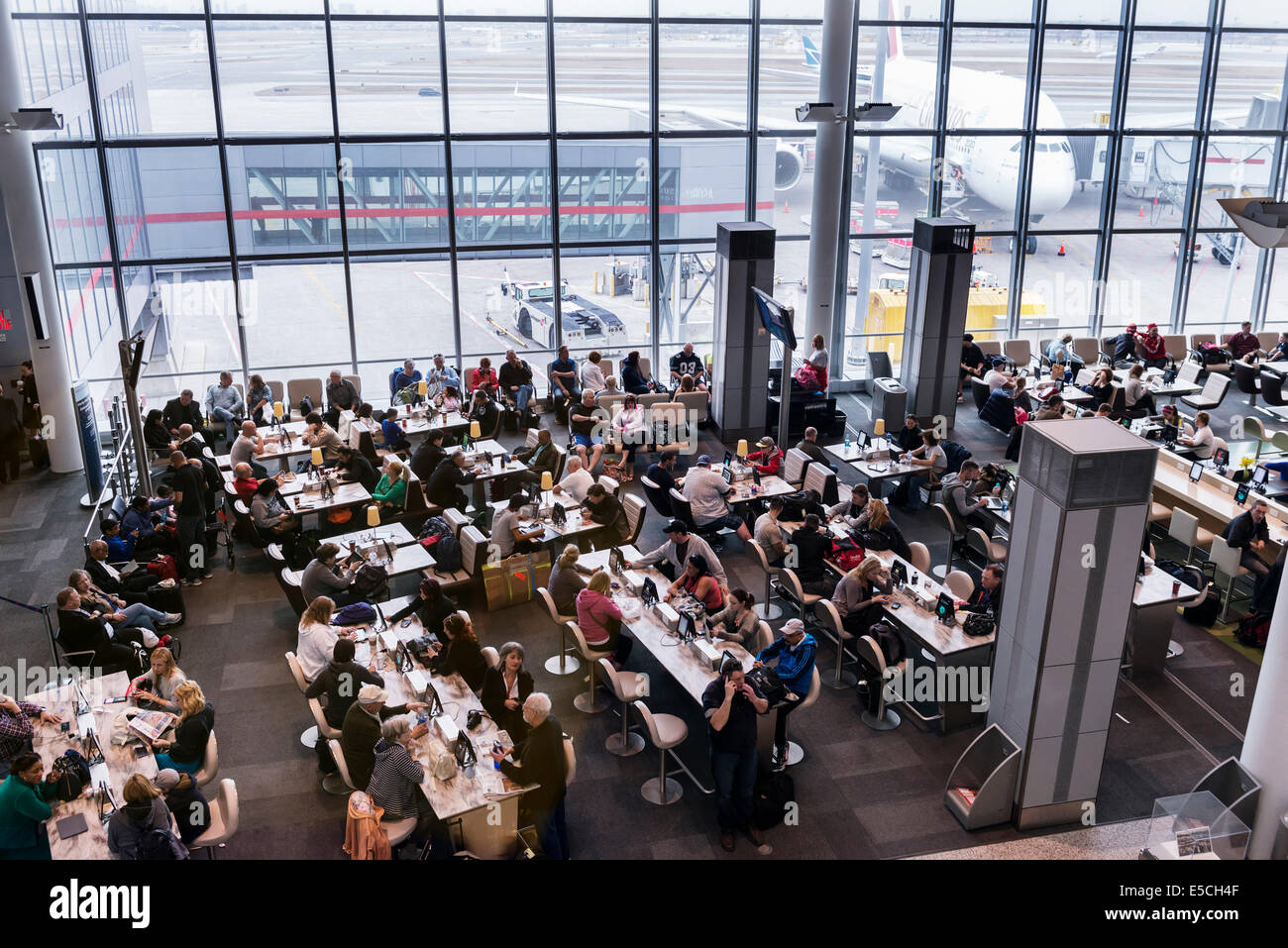 People in a waiting area of Toronto Pearson International airport, Canada 2014 Stock Photo