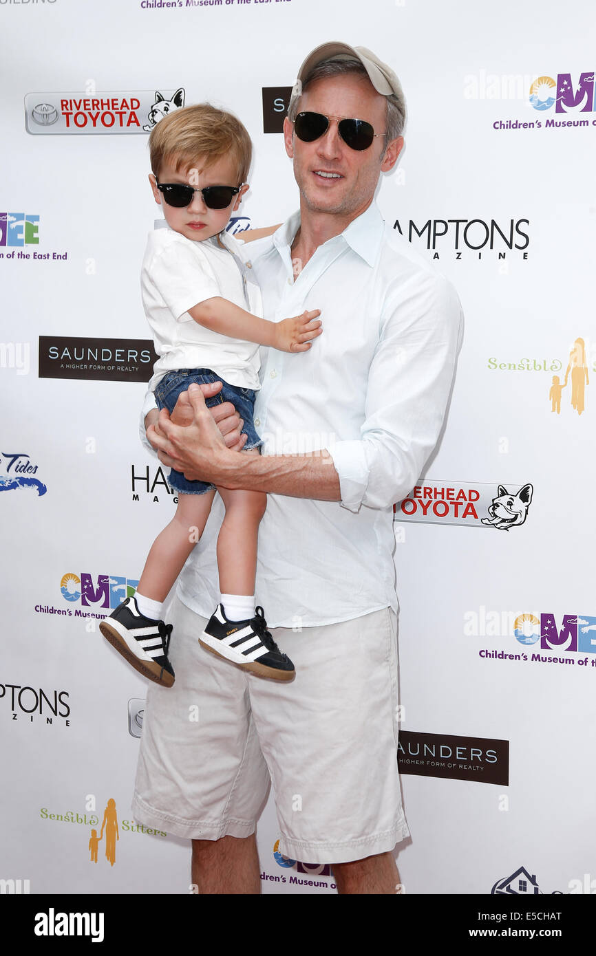 TV host Dan Abrams (R) and son Everett attend the 6th Annual Family Fair at the Children's Museum of the East End (CMEE). Stock Photo
