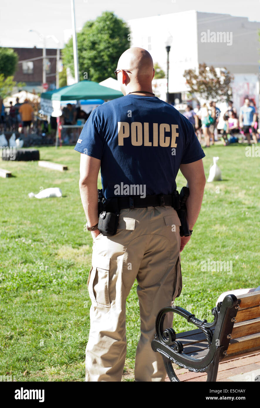 Policeman watching festivities at a Sanford North Carolina festival Stock Photo