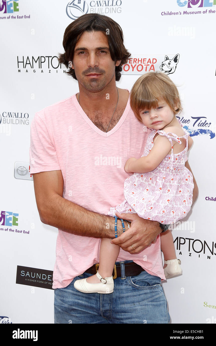 Argentine polo player Nacho Figueras (L) and daughter Alba Figueras attend the 6th Annual Family Fair at the Children's Museum. Stock Photo