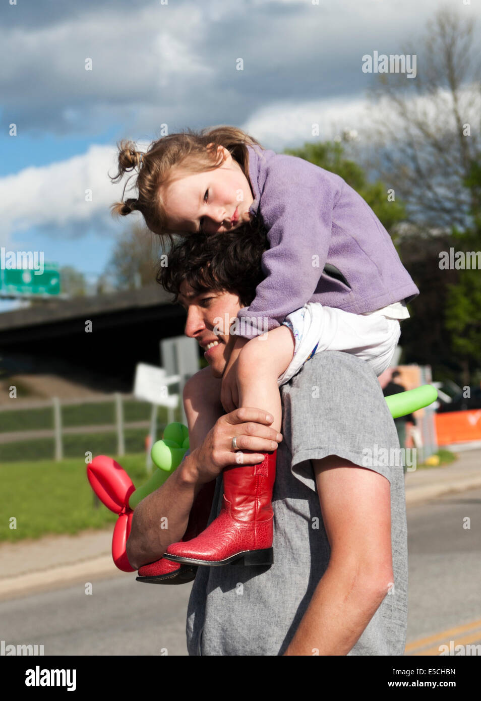 man carrying a baby on his shoulders stock photography and images - Alamy