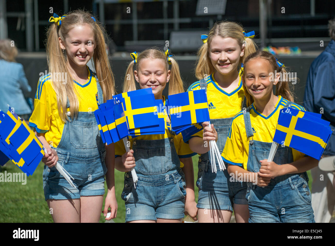 Smiling girls celebrating the National day of Sweden in Norrkoping. The national day of Sweden is celebrated on June 6 annually Stock Photo