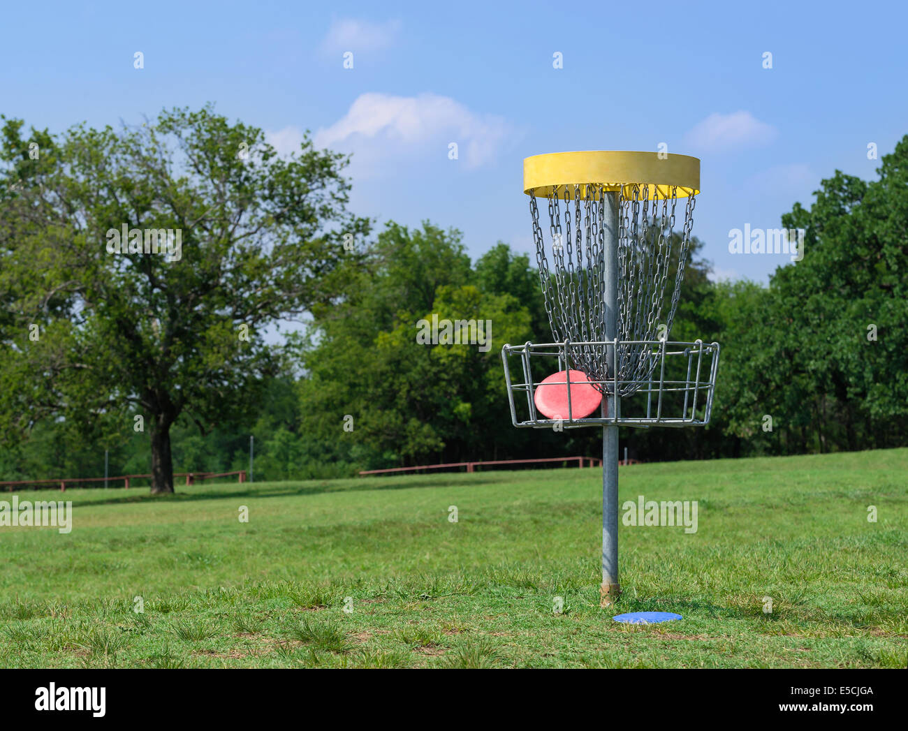 Disc golf hole basket in a park Stock Photo Alamy