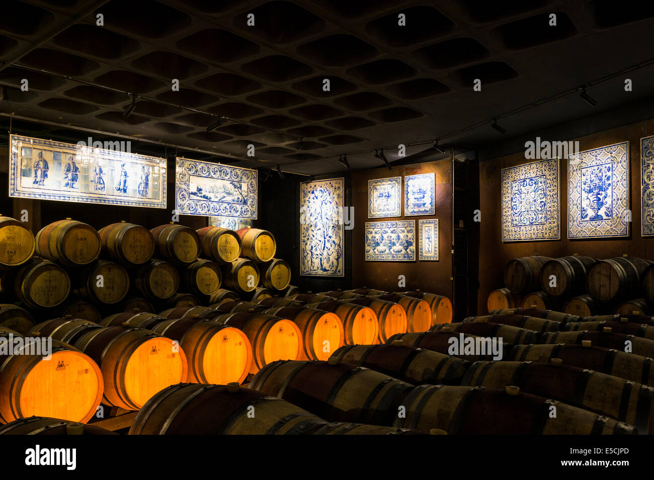 Wine barrels in a cellar decorated with antique azulejos, Bacalhoa Winery, Azeitao, Setubal Peninsula, Lisbon Coast, Portugal Stock Photo