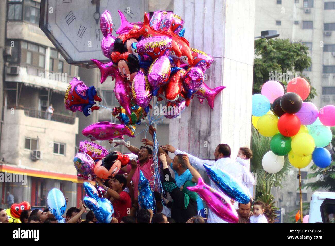 Cairo, Egypt. 28th July, 2014. Egyptian vendor sells balloons outside a