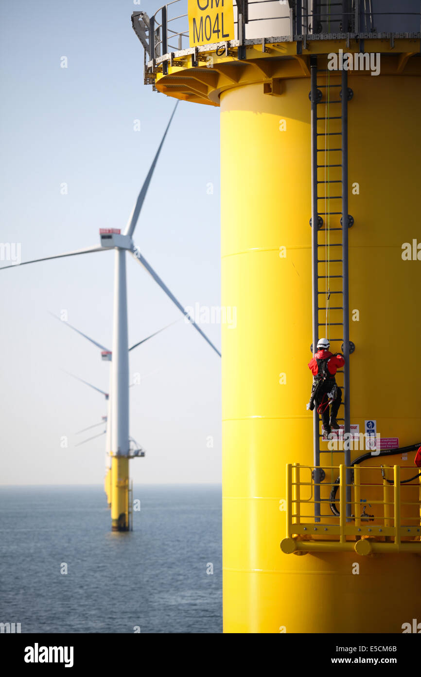 A worker on a turbine tower on the Gwynt y Mor Wind Farm off the coast of North Wales during the Construction Phase in 2014. Stock Photo