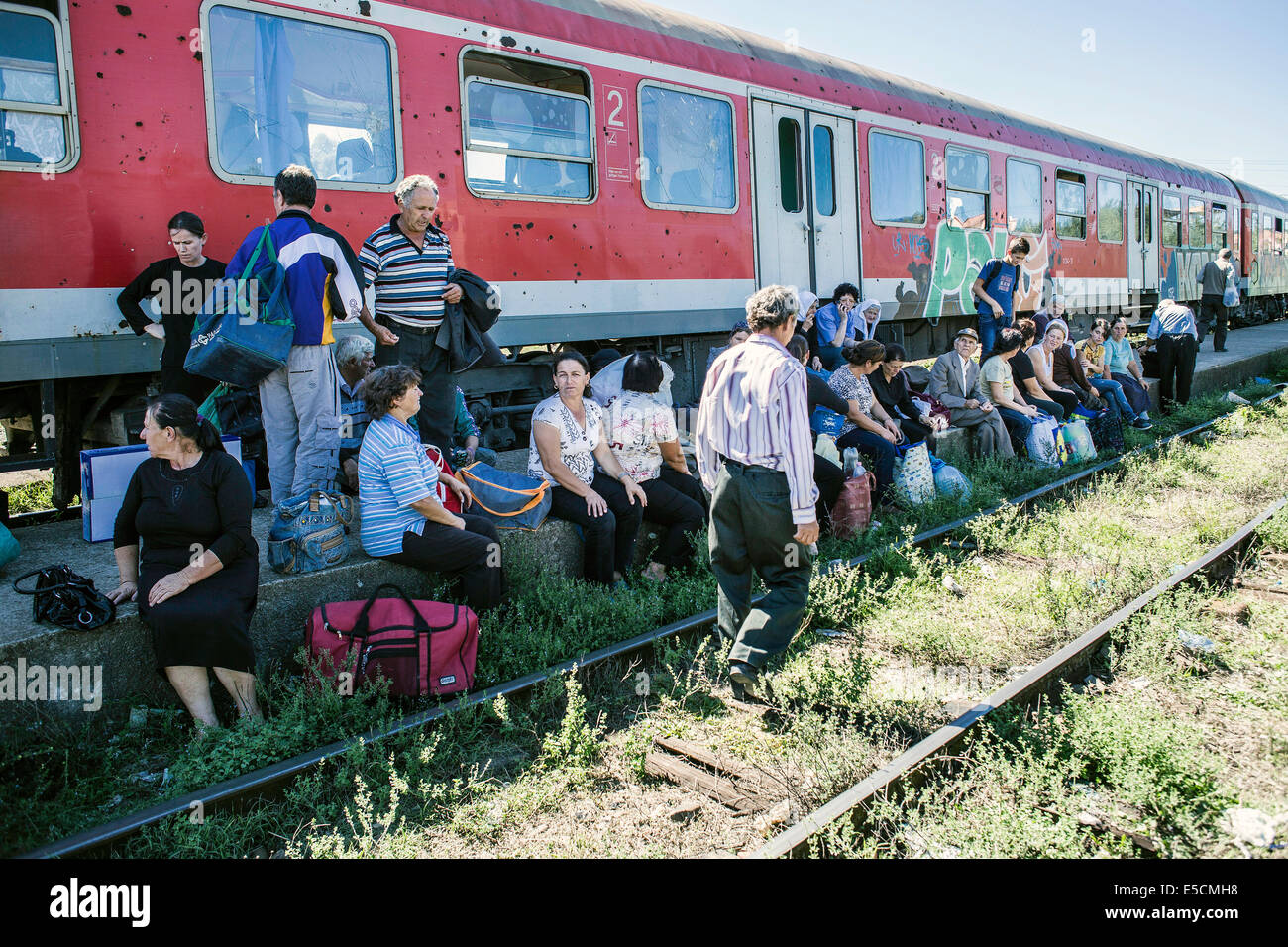 Day labourers and traders at the train from Tirana to Shkoder, one of the few train connections in the country, Albania Stock Photo