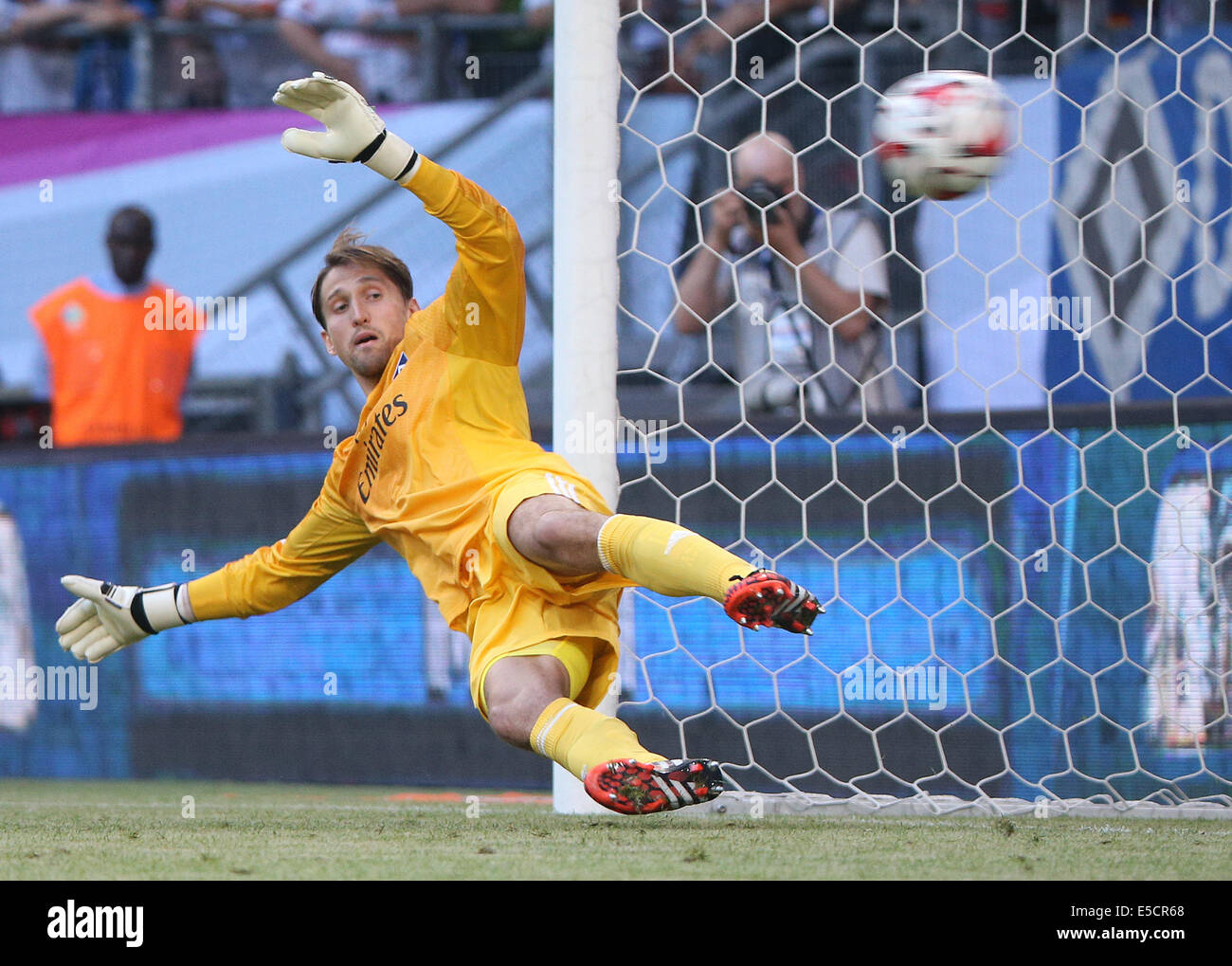 Hamburg, Germany. 26th July, 2014. Hamburg's goal keeper Rene Alder is not able to save a penalty during the Telekom Cup soccer match between Hamburger SV and VfL Wolfsburg in the Imtech Arena in Hamburg, Germany, 26 July 2014. Photo: Axel Heimken/dpa/Alamy Live News Stock Photo