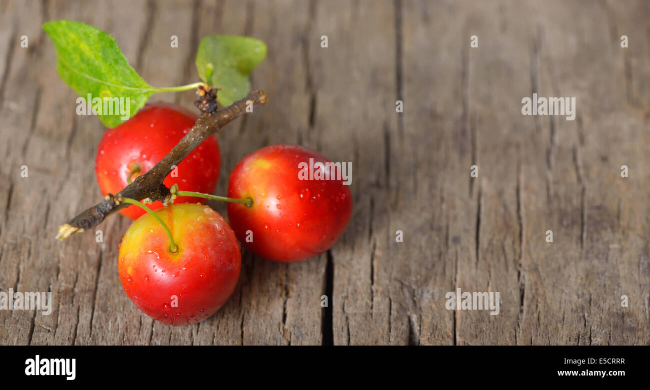 cherry-plum on wooden background Stock Photo