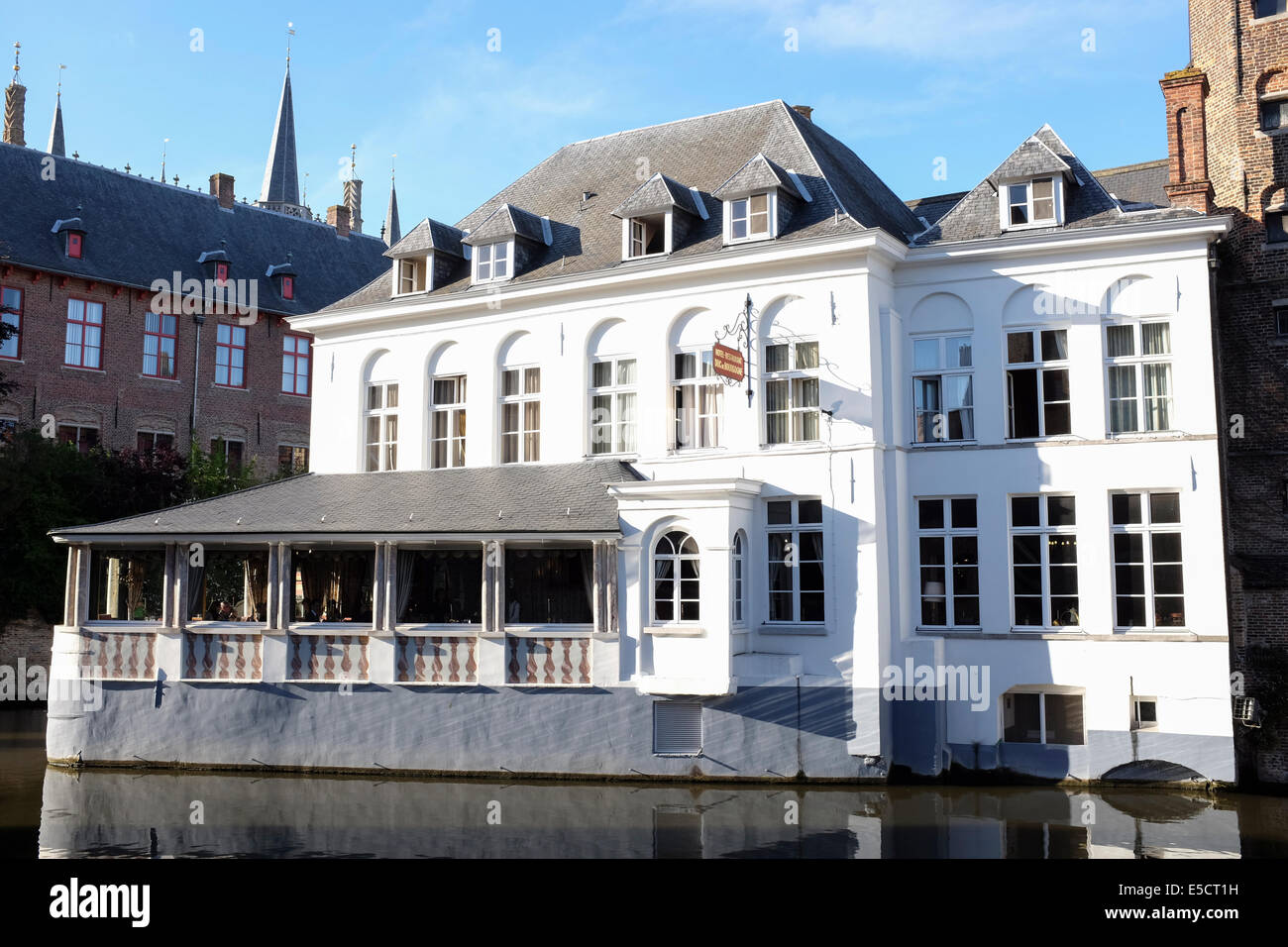 Hotel-Restaurant Duc de Bourgogne from the Rozenhoedkaai in the canal of Bruges old town, Belgium Stock Photo