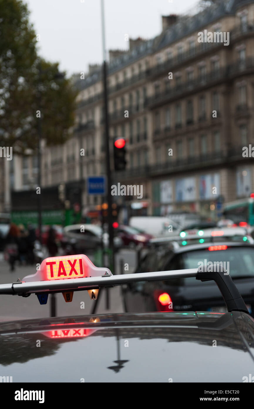 PARIS, FRANCE, 26th Oct 2012. Taxi on a city street at evening. Stock Photo