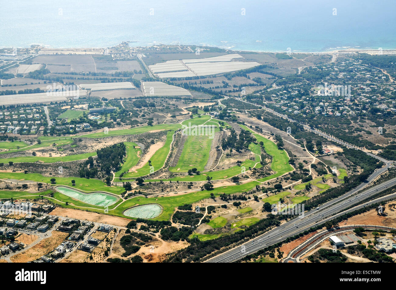 Aerial photography of Israel, Costal Plaine, the golf course at the modern  town of Caesarea Stock Photo - Alamy