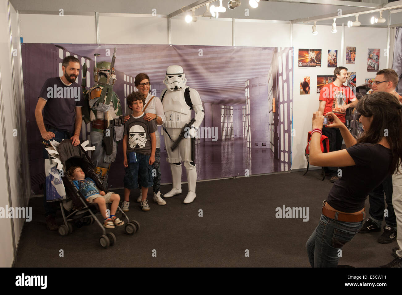 People taking photos with Boba Fett and Stormtrooper from Star Wars at Barcelona International Comic Fair on May 17, 2014 in Barcelona, Catalonia, Sp Stock Photo