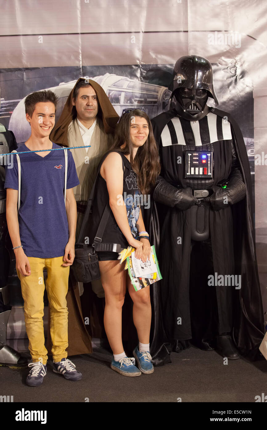 Teens posing with Darth Vader from Star Wars at Barcelona International Comic Fair, May 17,  Barcelona 2014, Catalonia, Spain. Stock Photo