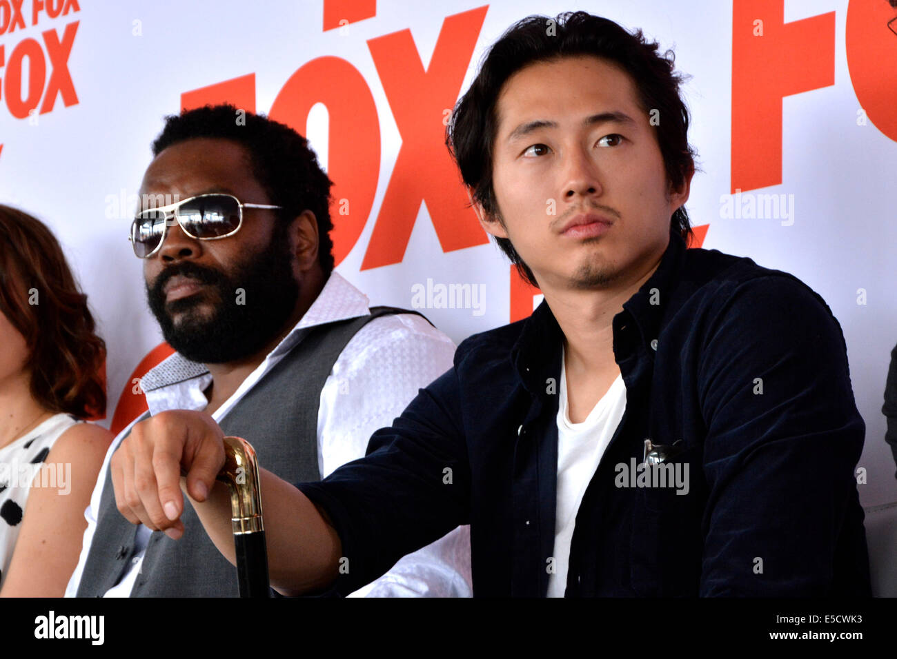 Chad L. Coleman and Steven Yeun attend the FOX Press Breakfast press conference of the series 'The Walking Dead' on July 25, 2014 at the roof lounge of the Andaz Hotel in San Diego during the San Diego Comic-Con International. Stock Photo