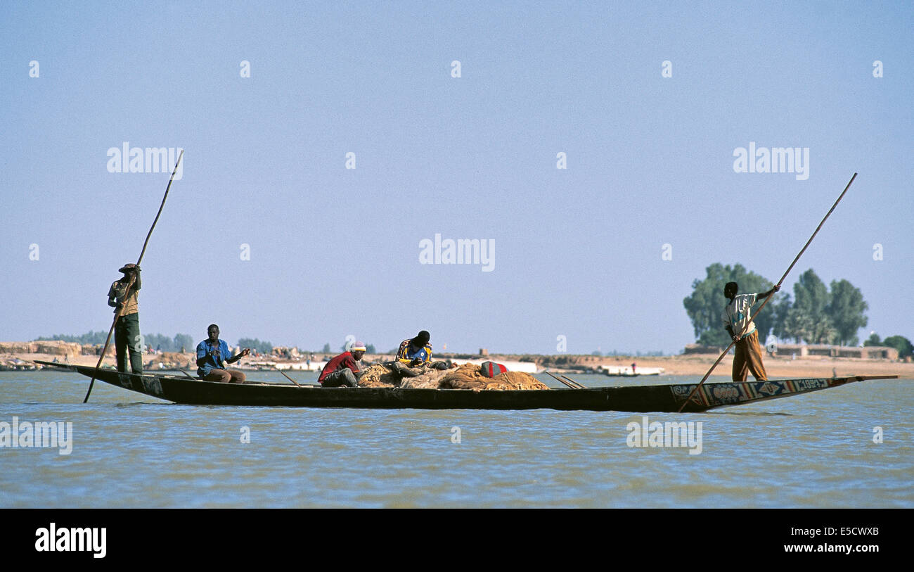 African fisherman pinnace navigating the river Niger in Mopti, most important commercial port from Mali Stock Photo
