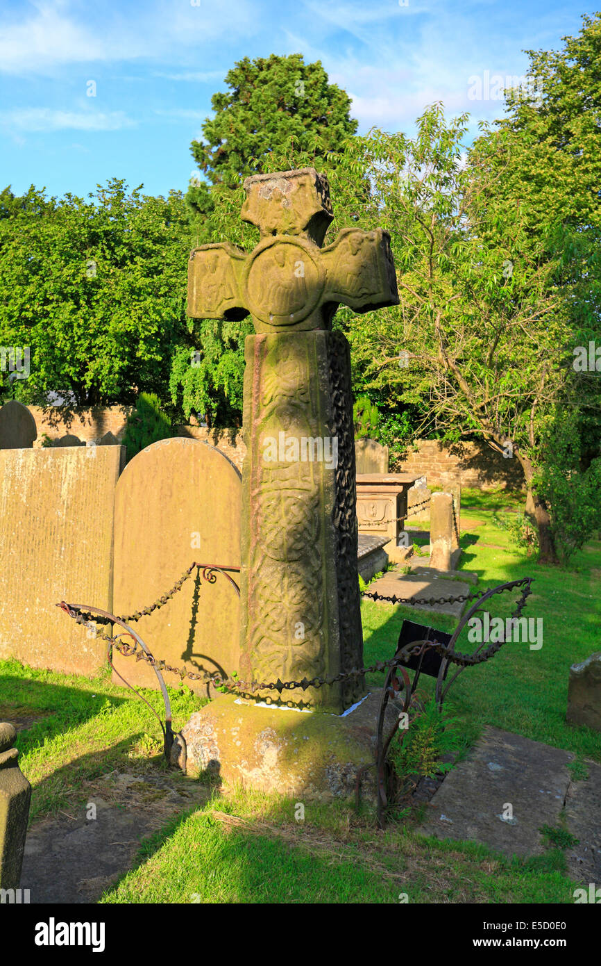 Anglo-Saxon 8th century Celtic cross in St Lawrence Church, Eyam plague village, Derbyshire, Peak District National Park, England, UK. Stock Photo